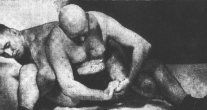 rudy-dusek-applying-hold-to-bald-wrestler